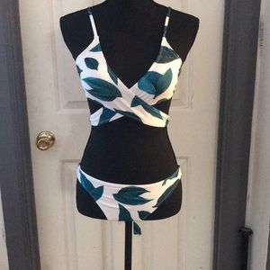 White bathing suit with leaves